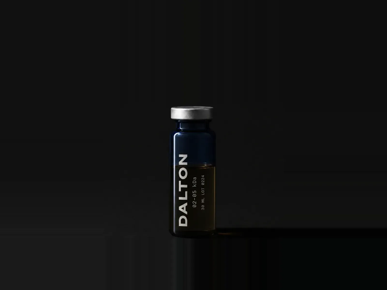 A single DALTON 02-05 vial, silver cap on, standing on a dark ground.